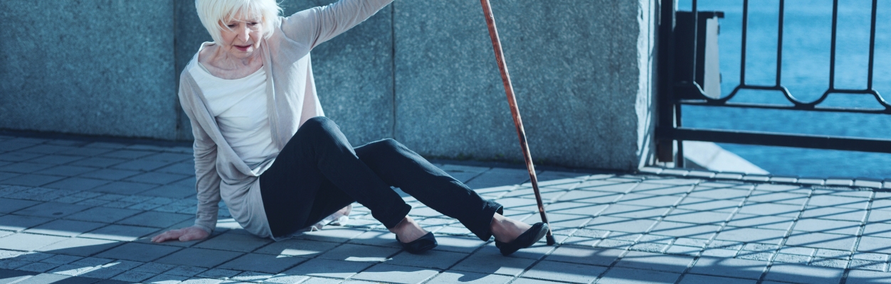 Lady falling on pavement